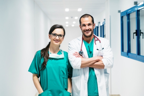 Two smiling doctors in the hospital.